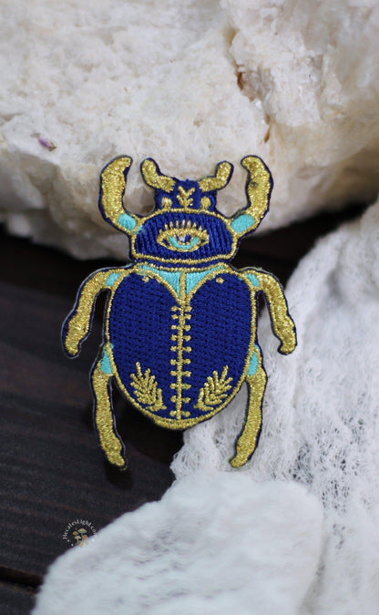 Blue Scarab Beetle Patch MALICIEUSE beetle, blue, calgary, canada, cloth, clothing, dung, embellishment, embroidered, embroidery, gold, iron, iron-on, patch, scarab, turquoise, witchy clothing metaphysical occult supplies witchy hecateslight.com witchcraft cottagecore witch gifts